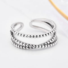 LUCREZIA TWIST STERLING SILVER BEAD RING