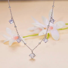 ABELIA STERLING SILVER MOISSANITE CHARM NECKLACE